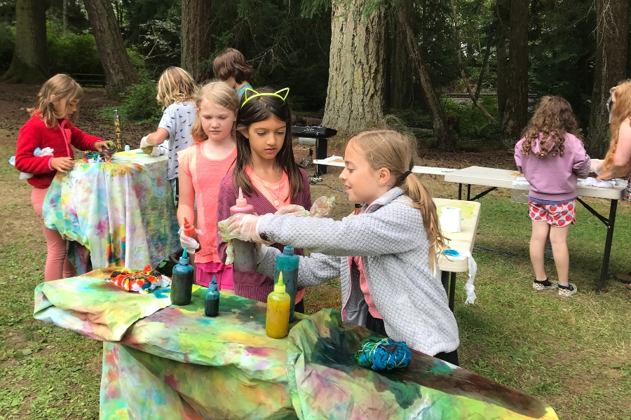 Outdoor arts camp for kids in Bellingham, photo shows children doing tie dye projects at a summer camp for Whatcom County youth dance camp drama camp theater camp